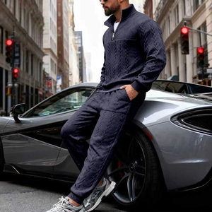 Detailed close-up of navy blue cable knit texture on men's winter sports tracksuit set