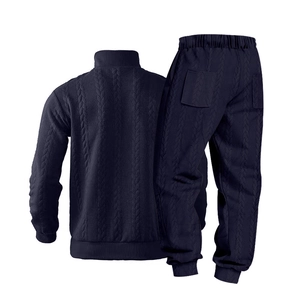 Rear view of men's navy blue knitted tracksuit with thick cable stitch texture