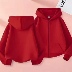 Flat lay of red oversized zip-up hoodie showing front and back views on pink background