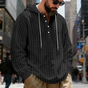 Detail of the striped linen hoodie with white drawstring and contrasting henley buttons