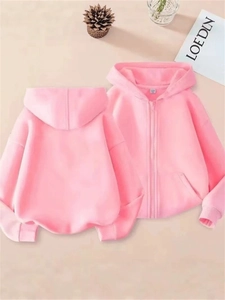 Front and back view of a soft pink zip-up fleece hoodie with ribbed cuffs and hem
