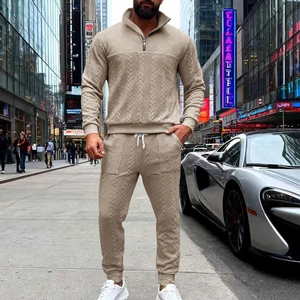 Detailed close-up of men's casual two-piece set featuring textured knit striped fabric