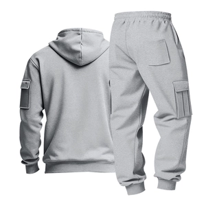 Detail view of dark grey hoodie set featuring tactical sleeve pocket and cargo pants