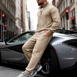 Detailed cable knit texture of men's beige two-piece lounge set with quarter-zip collar