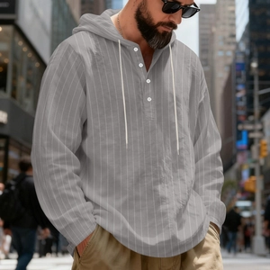 Detail of grey striped linen hoodie shirt with buttoned Henley neck and drawstring