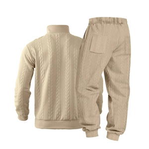 Detailed back view of beige cable-knit track jacket and joggers with ribbed textures
