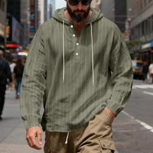 Close-up of olive green striped linen hoodie with henley button neck and cream drawstrings