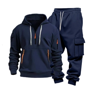 Detail view of navy blue tracksuit with half-zip hoodie and cargo sweatpants in set