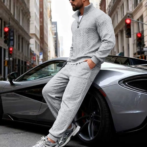 Close-up of gray knitted two-piece set featuring half-zip collar and luxury urban style