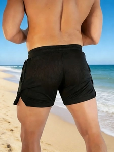 Men's quick-dry black running shorts with side slits and breathable fabric texture
