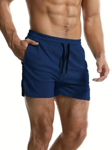 Detail of dark blue athletic shorts featuring elastic waistband and adjustable drawstring