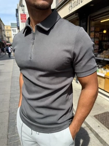 Men's dark gray short sleeve polo shirt with zipper collar and textured knit fabric