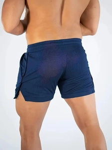 Rear view of navy blue mesh workout shorts featuring elastic waistband and side split detail