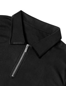 Close-up of black polo shirt collar with silver half-zip and breathable mesh fabric