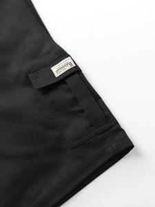 Men's black cargo shorts featuring a side flap pocket and stylish brand label detail