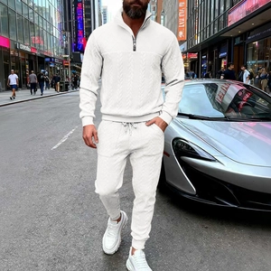 Men's white textured knit sweatsuit set with quarter-zip top and matching drawstring pants
