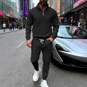 Men's black textured half-zip tracksuit set with matching joggers for casual streetwear