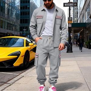 Tuta sportiva grigia da uomo con giacca a revers e pantaloni con coulisse e bande a righe