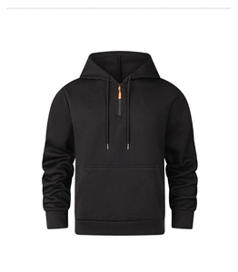 Close-up of men's black hoodie featuring orange half-zipper detail and drawstring hood