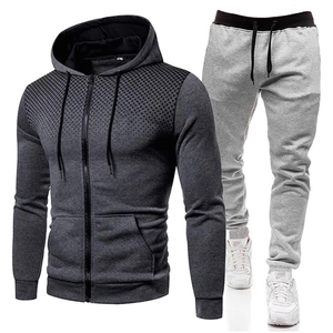 Detail of grey men's tracksuit with hooded zip-up jacket and gradient dot print