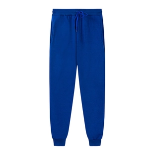 Detailed view of elastic drawstring waistband and side pockets on royal blue sweatpants
