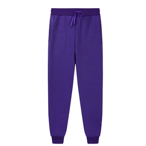 Detail view of purple joggers featuring elastic drawstring waist and ribbed ankle cuffs
