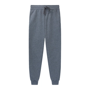 Detail of grey men's fleece jogger pants showing elastic drawstring waist and fabric texture