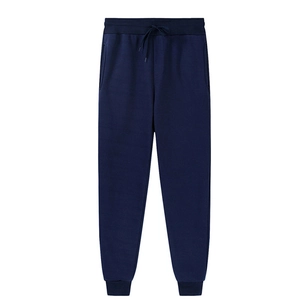 Detail of navy blue fleece joggers featuring elastic drawstring waist and ribbed cuffs