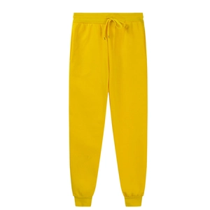 Detail view of yellow joggers featuring elastic waistband and drawstring adjustment