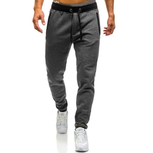 Detail of dark grey fleece joggers showing black contrast waistband and side pockets