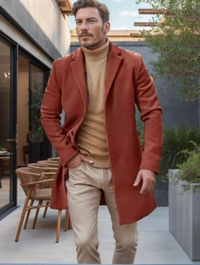 Detail of rust red wool overcoat featuring wide lapels and classic tailored buttons