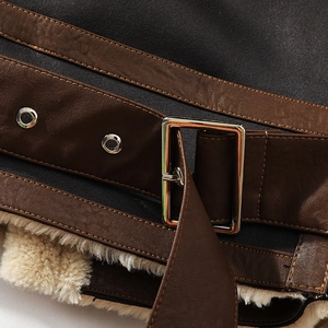 Winter faux leather motorcycle jacket detail showing silver buckle and warm shearling lining