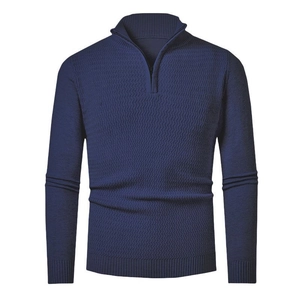 Detail of 1/4 zip collar and textured wave knit pattern on navy blue men sweater