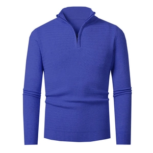 Detailed view of the royal blue knitted texture and zip collar on a slim sweater