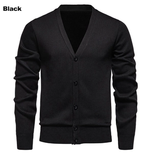 Detail of men's black knit cardigan featuring a V-neck and classic button-down closure