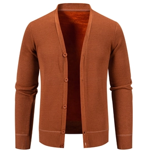Close-up of caramel men's knitted cardigan showing rib-knit cuffs and fleece lining texture