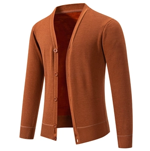 Detail of caramel knit cardigan showing V-neck, buttons, and warm fleece lining texture