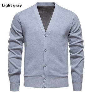 Detail of light gray ribbed knit cardigan with V-neck and soft fleece lining for men