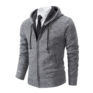 Detailed view of gray knitted hoodie featuring thick fleece lining and textured waffle pattern