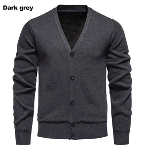 Detail of dark grey men cardigan showing warm black fleece lining and ribbed cuffs