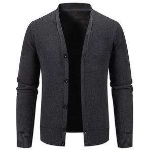 Detail of dark grey men's knit cardigan with ribbed cuffs and classic button closure