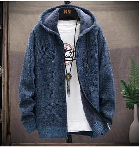 Detail of blue knitted cardigan with warm faux shearling lining and stylish zipper
