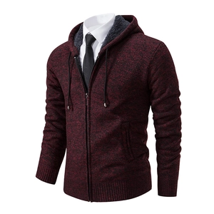 Detail of burgundy knit cardigan with thick grey fleece lining and zipper closure