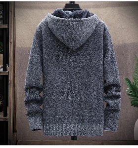 Close-up of men's knit cardigan with thick grey fleece lining and warm texture