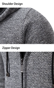 Detailed macro view of the grey honeycomb knitted fabric and premium metal zipper on hoodie
