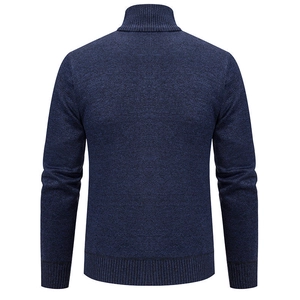 Detailed back view of navy blue cable knit sweater showing ribbed collar and hem texture