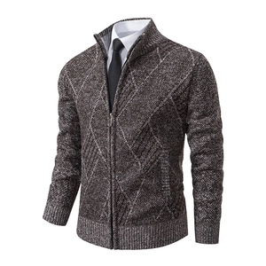 Macro detail of men's slim fit cardigan featuring gray argyle knit pattern and zip collar