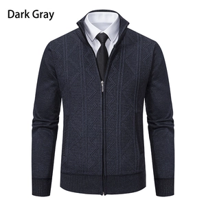 Detail of dark gray cardigan showing geometric diamond knit pattern and stand collar