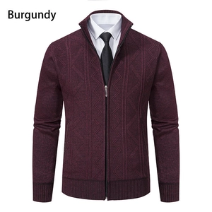 Detail of burgundy zip-up cardigan featuring geometric knit patterns and a stand collar