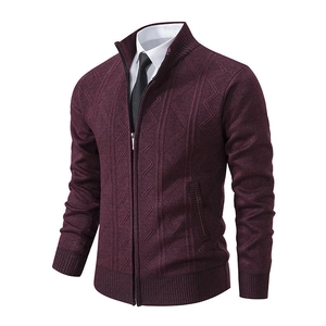 Close-up of burgundy knit cardigan featuring geometric texture and stand collar zipper